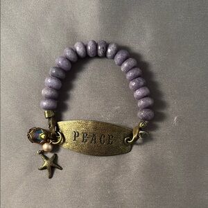 Purple Beaded Bracelet with Gold 'Peace' Charm
